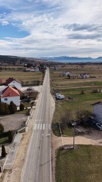 White mosque with green dome and minaret in Guber village near Livno