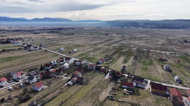 White mosque with green dome and minaret in Guber village near Livno