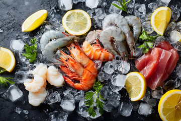 Fresh seafood with shrimp, fish, and lemon on ice at a market setting
