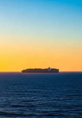 Obraz premium An enormous cargo vessel, stretching across the horizon, navigates a boundless, deep ocean under an expansive sky, emphasizing immense scale, magnitude, maritime, navigating