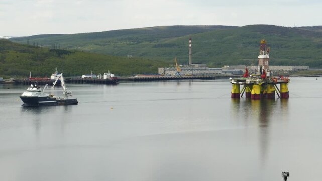 Murmansk, Russia - June 25, 2017: Ships and a Chinese floating drilling rig in the Kola Bay. Barents Sea, Gulf Stream.