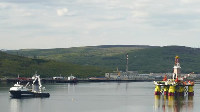 Murmansk, Russia - June 25, 2017: Ships and a Chinese floating drilling rig in the Kola Bay. Barents Sea, Gulf Stream.