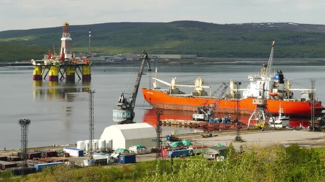 Murmansk, Russia - June 25, 2017: Ships and a Chinese floating drilling rig in the Kola Bay. Barents Sea, Gulf Stream.