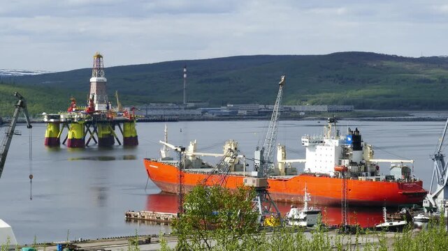 Murmansk, Russia - June 25, 2017: Ships and a Chinese floating drilling rig in the Kola Bay. Barents Sea, Gulf Stream.