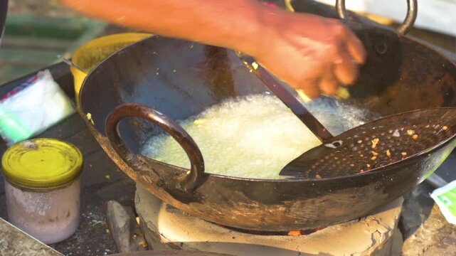 Street Vendor Frying Pakora at Local Fair in Kolkata India