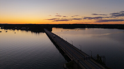 Obraz premium Sunset aerial View of the Great Bay at the Scammell Bridge in New Hampshire