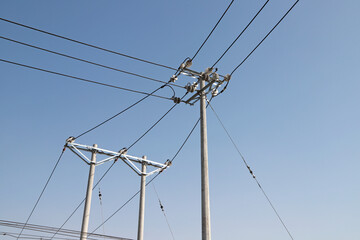 Wooden Utility Poles with Power Lines Under Clear Sky