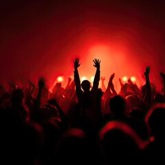 Crowd of People at Concert with Red Stage Lights and Raised Hands in Dark Atmosphere