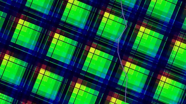 Close-up of a vibrant plaid pattern with green, blue, and yellow squares on a fabric with a shallow depth of field.