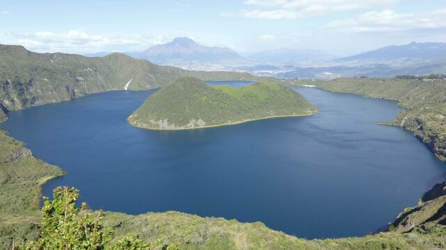 Cotacachi, Ecuador - November 5, 2025: Cuicocha Lagoon is a crater lake at the foot of the Cotacachi Volcano. Its deep blue waters and volcanic islets create a stunning natural landscape.