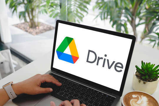 Bangkok, Thailand. March 4, 2026; A person accessing the Google Drive cloud storage service on a MacBook Pro while working at a bright cafe table.