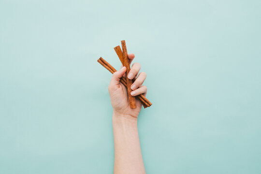 hand holding cinnamon