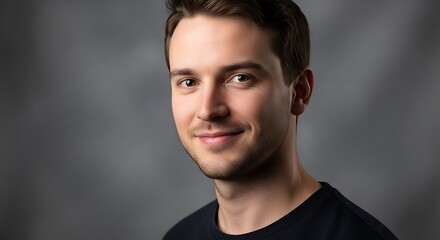 Obraz premium Studio portrait of slightly smiling young adult Caucasian man, selective focus