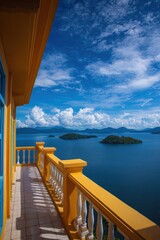 Real estate business market, house home building purchase sale. A balcony with a yellow railing overlooking a tranquil body of water.