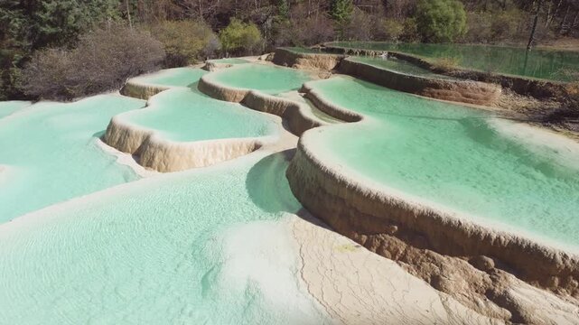 Close up view of Shenxianchi Scenic Area in Sichuan, China, near Jiuzhaigou and Huanglong, peaceful and clean water in pond among mountains, 4k slow motion footage travel concept.
