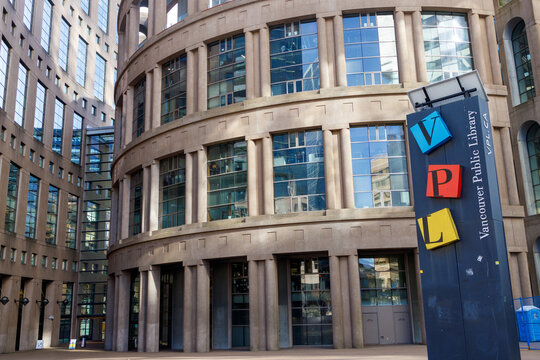 Vancouver Public Library central branch entrance with VPL signage, curved facade with columns and glass windows