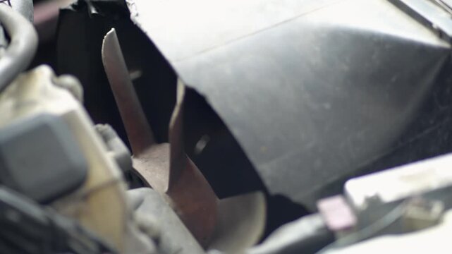 Rotating car large fan blades from the engine cooling system