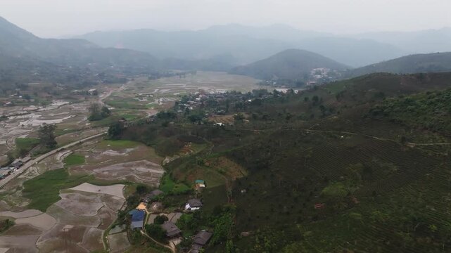 Cascading green rice fields on na pheo mountain slopes vietnam showcasing the natural beauty and agriculture of the region.