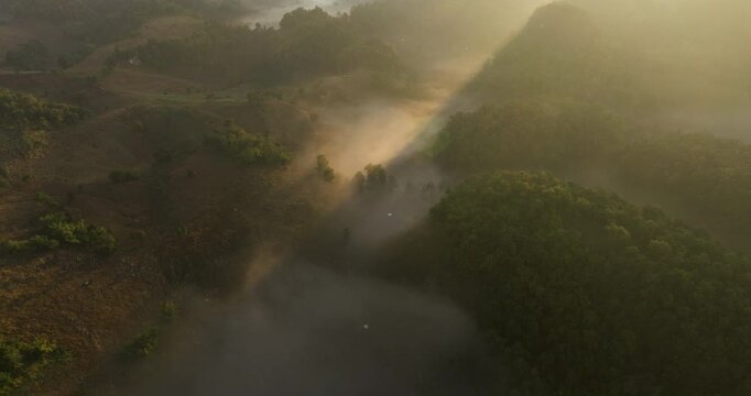 Sunrise Over The Mountains With Sea Of Clouds Near Ban Jabo In Mae Hong Son, Thailand. Aerial Tilt-up Shot