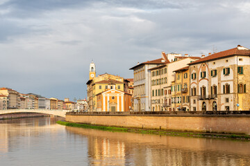 Historic buildings built along the edge of the Arno river, Pisa