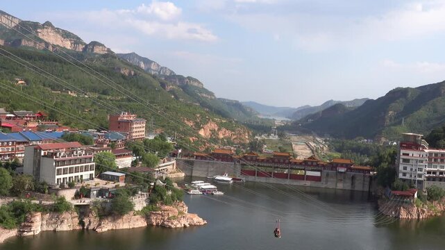 Breathtaking aerial footage of Guangfu Ancient City in Hebei, featuring well-preserved Ming Dynasty walls surrounded by moats, traditional architecture, and beautiful northern water town scenery.