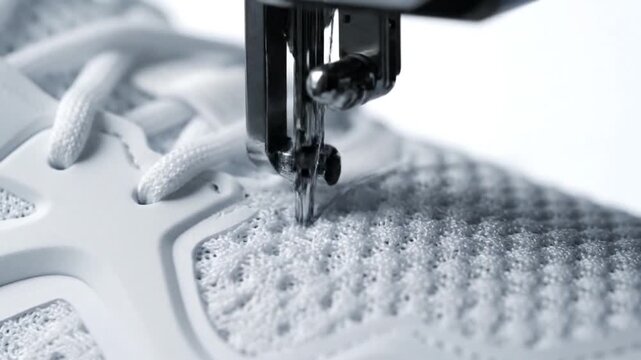 Sewing Machine Creating Intricate Stitches on Fabric.
