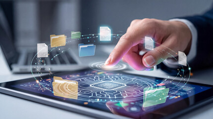 Business professional using a tablet with digital interface and data files floating around representing cloud storage and technology
