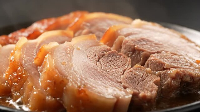 Korean bossam boiled pork dish close-up macro slow rotation tender meat cuisine food