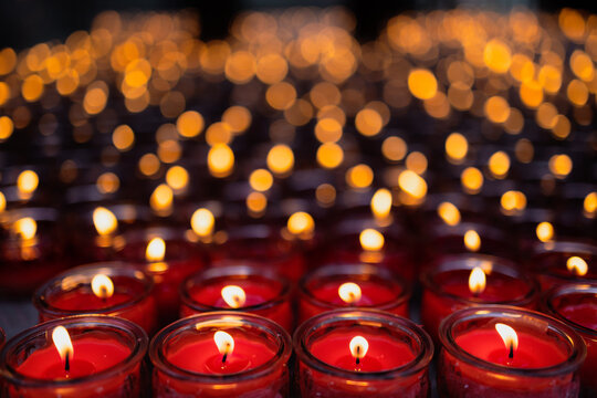 Red candles burning offering light and hope