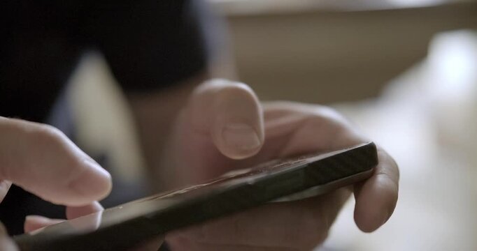 Man playing mobile phone close-up. High quality 4k footage
