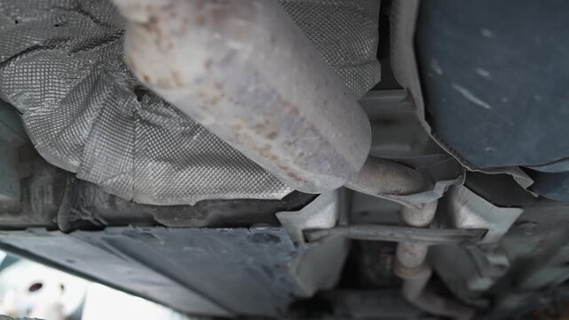 Car exhaust system seen in mechanic repair shop