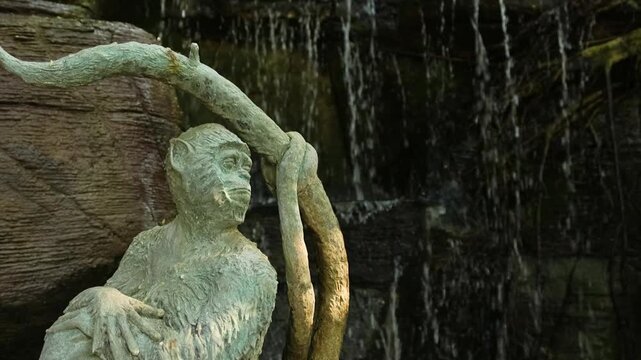 Monkey Statue with Waterfall at Wat Saket Golden Mount Temple Bangkok Thailand