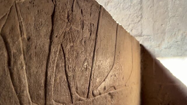 Close Up of Ancient Egyptian Wall Relief Carving Depicting Ritual Figures Inside the Mortuary Temple of Khufu at Giza Necropolis