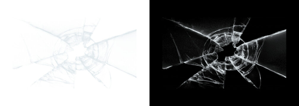 Cracked glass on white and black backgrounds broken window pane with radial fracture lines