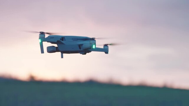 Drone quad copter on green agriculture field, isolated cinematic selective focus shot