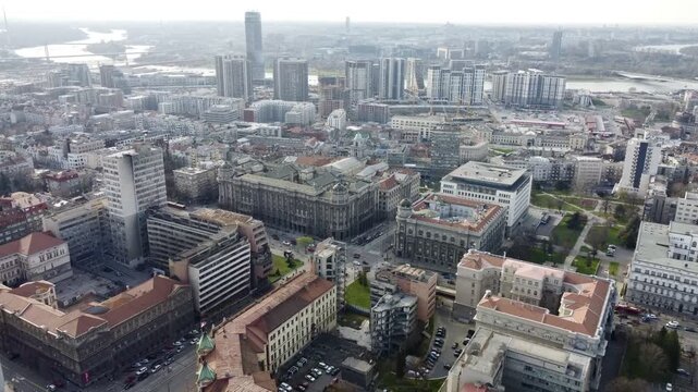 Aerial cityscape with ministry of defence area, damaged during NATO bombing, and nearby waterfront district. g
