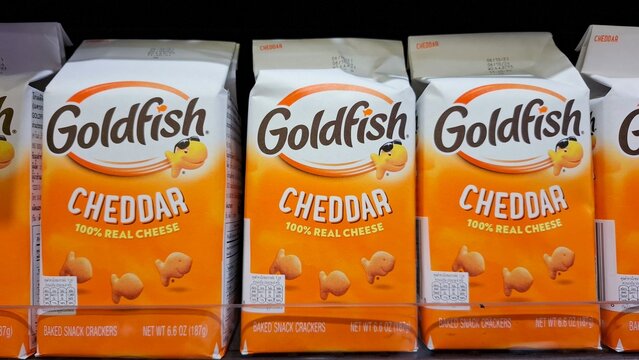 Pepperidge Farm Goldfish cheddar cheese baked snack crackers in cartons arranged on retail grocery store shelf on February 27, 2026 in Bangkok, Thailand