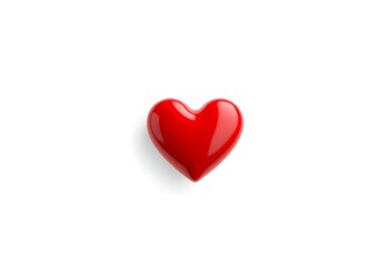 Fototapeta premium A single red heart sits alone on a white surface indoors.
