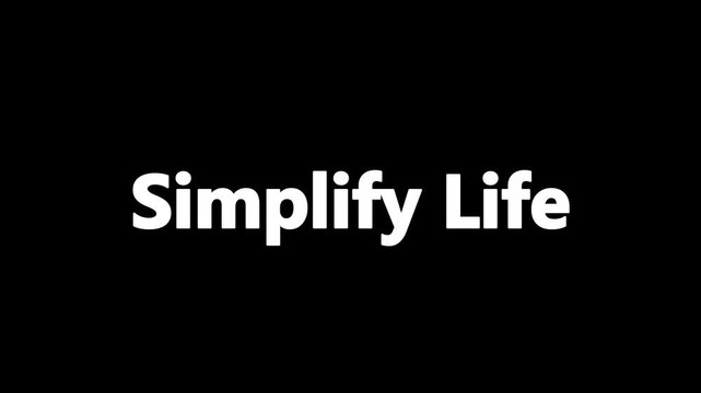 Captivating motion graphic displaying the motivational phrase 'Simplify Life' materializing on a deep black canvas, surrounded by ethereal glowing particles and soft, intricate snowflake patterns.