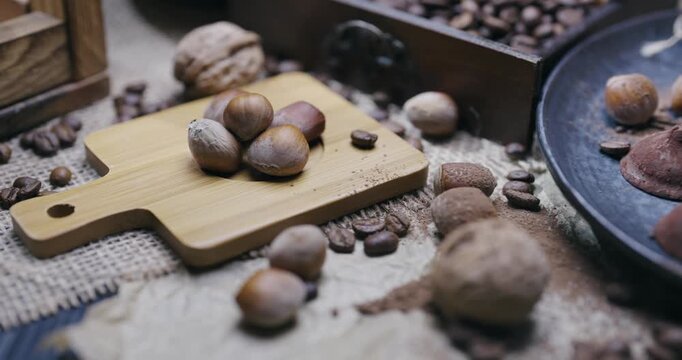 Farmed organic whole and shelled hazelnuts on a wooden table in rustic style. Healthy fats macro vintage advertisement scene