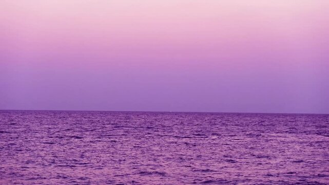 Magenta purple Sunset over calm ocean wave n sea water on Colorful gradient blue sky at everning twilight in tropical summer sunlight sunshine day on island paradise, Phuket Thailand 4k TimeLapse