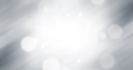 Blurred glitter effects background. Bright soft blue with hints of pearl color. Christmas background. Festive Christmas backdrop with holiday charm. Blurred bokeh light on dark blue background.