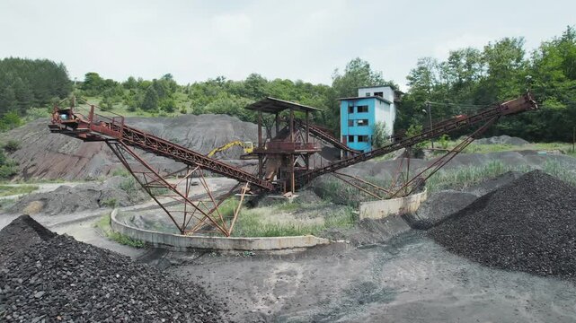 Aerial view of open pit mine, coal mining of minerals with conveyor bel