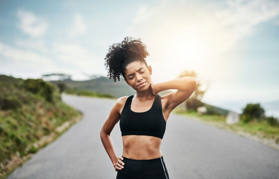 Fitness, exercise and black woman with neck pain on road, bad running form and muscle strain for injury. Outdoor, sunshine and athlete with discomfort for poor training posture, ache and inflammation