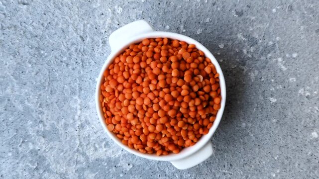 Raw red lentils as a source of protein for a healthy vegan meal. Red lentils as a food background for your design