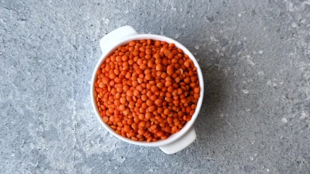 Raw red lentils as a source of protein for a healthy vegan meal. Red lentils as a food background for your design