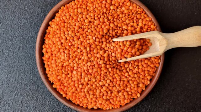 Raw red lentils as a source of protein for a healthy vegan meal. Red lentils as a food background for your design