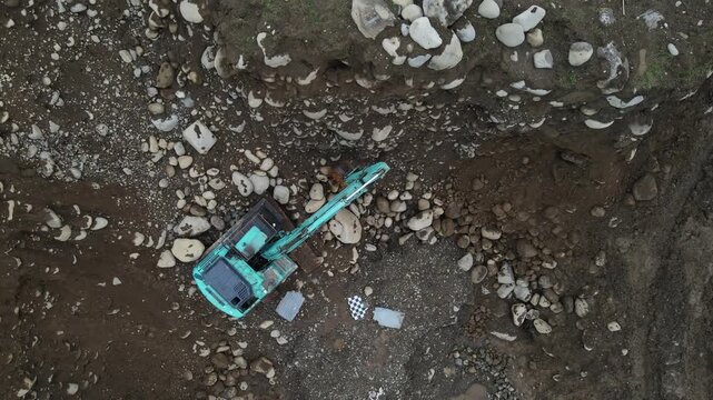 Breaker Excavator Operating in Rock Quarry, Mining Site View from Above