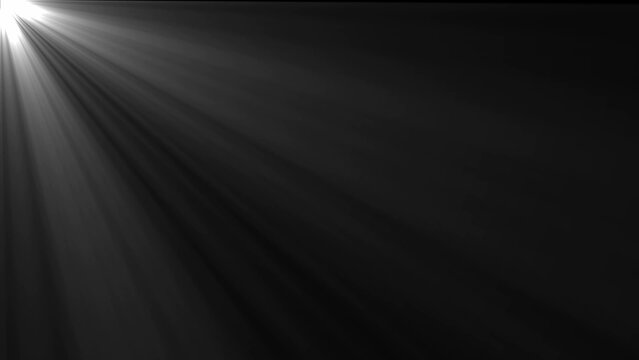 Bright white light rays streaming from the upper left corner diagonally across a dark gray background Keywords: white light rays, upper left corner