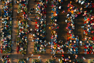 Aerial view of busy local daily life of the morning local market in Vi Thanh or Chom Hom market, Mekong Delta, Vietnam. © CravenA